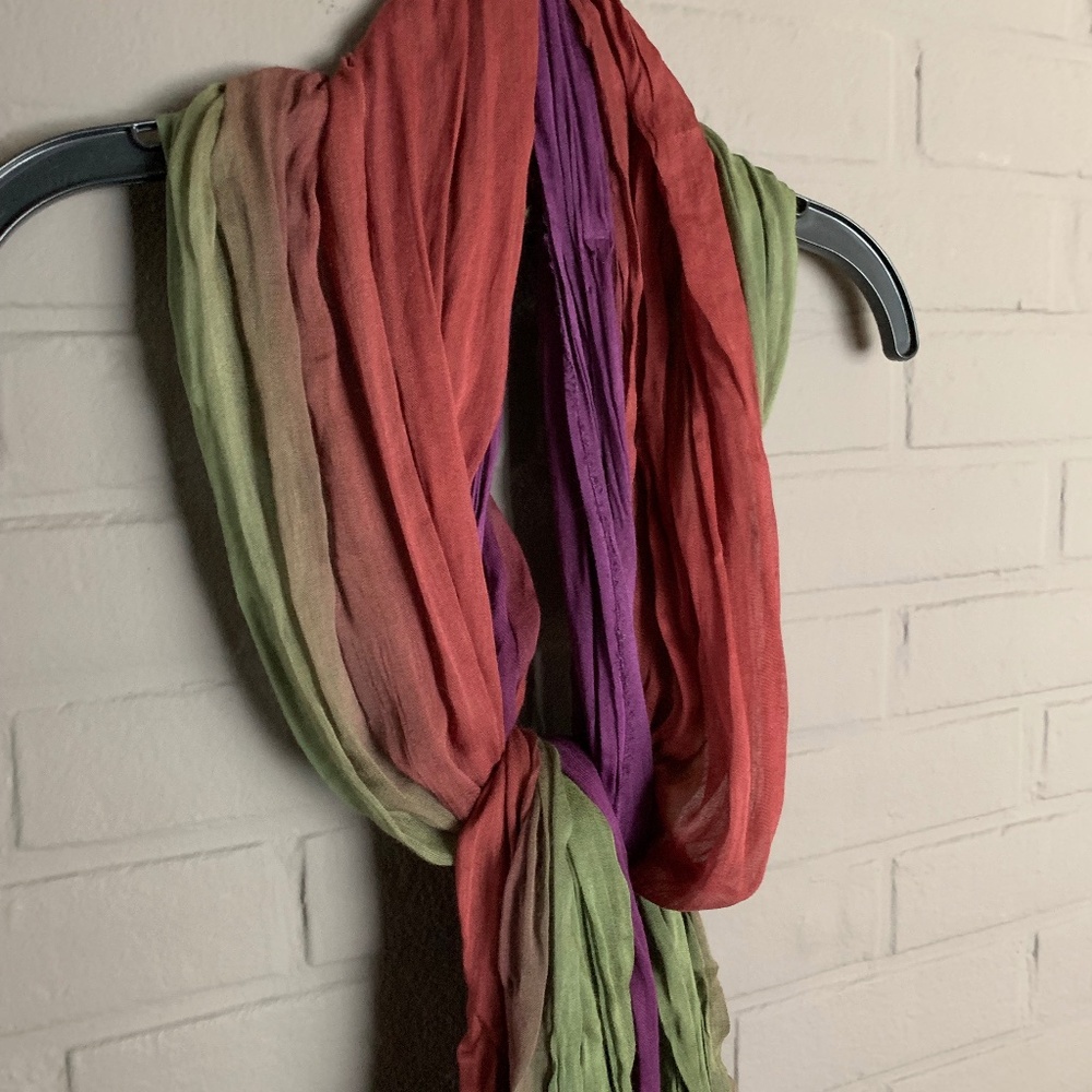 Colorful died long scarf is in shades of purple, red and green. NWT